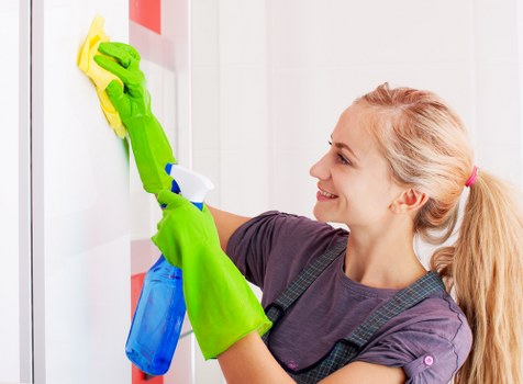 Office cleaning team maintaining a modern SW8 workplace reception area