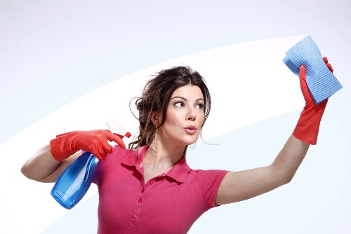 Deep cleaning a living room sofa in an SW8 property